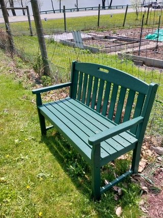 Trex bench by pollinator garden May 2024